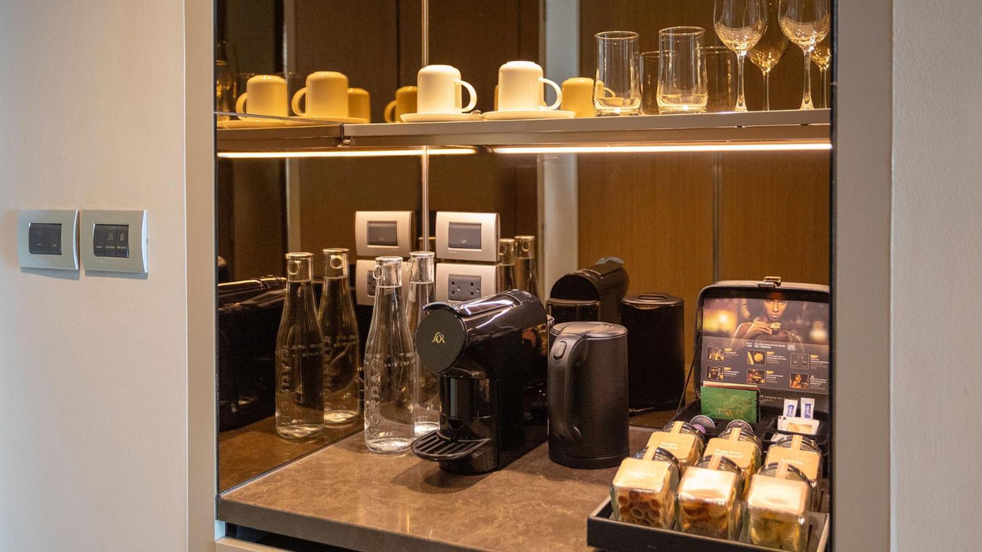 Chatrium Grand Bangkok Exterior foto A Nespresso machine in a hotel room